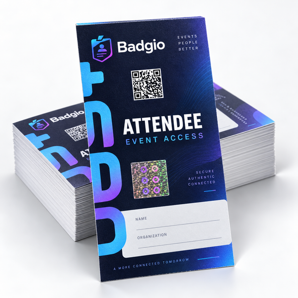 Stack of navy Badgio event tickets with QR code and holographic seal