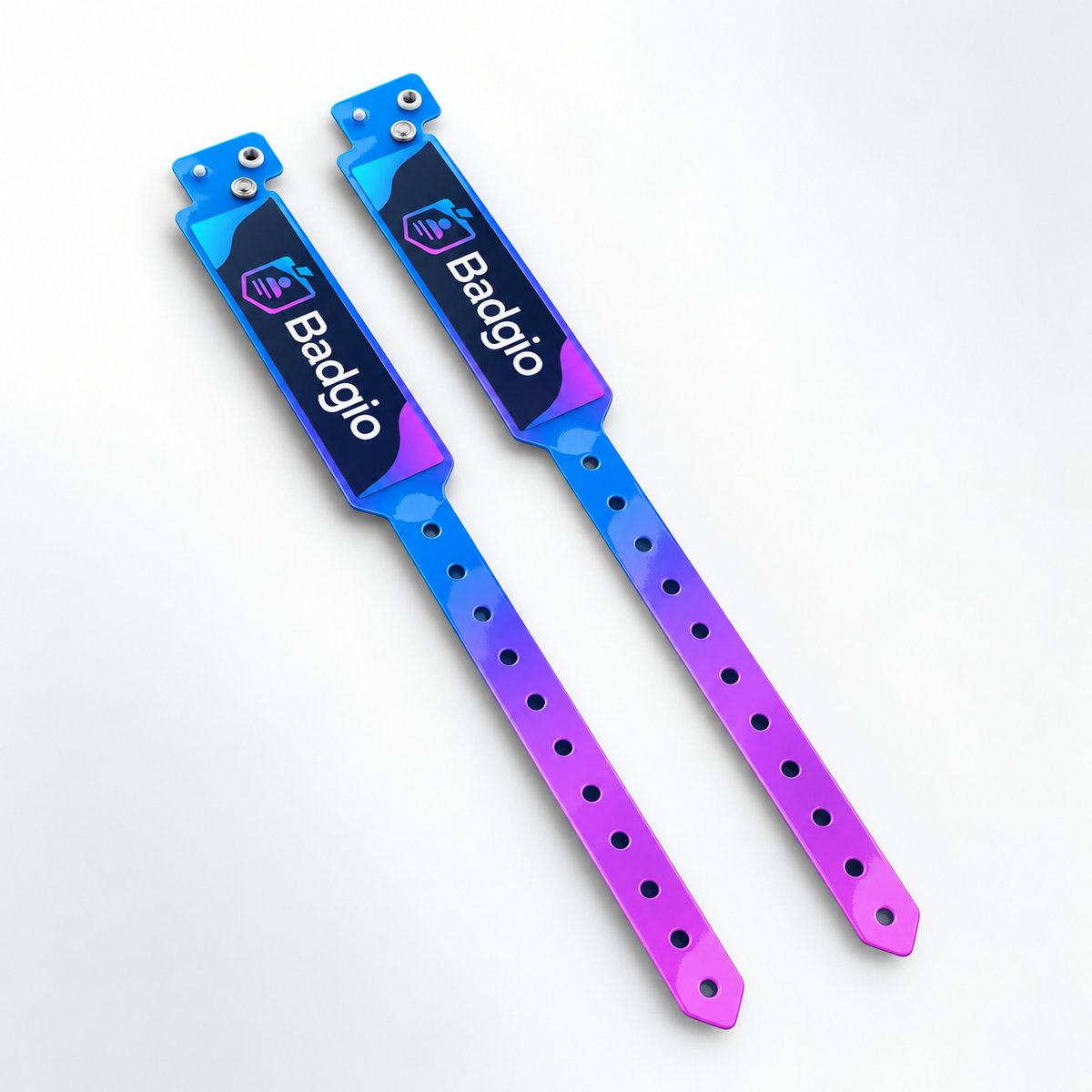 Two glossy PVC vinyl wristbands with adjustable snap closures