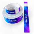 Roll of PP wristband material beside a printed strip with tear tab