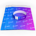 Stack of DuPont paper wristband sheets with one band formed into a loop